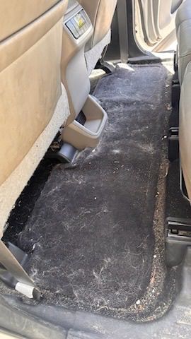 Before: dirty car interior — San Diego auto detailing
