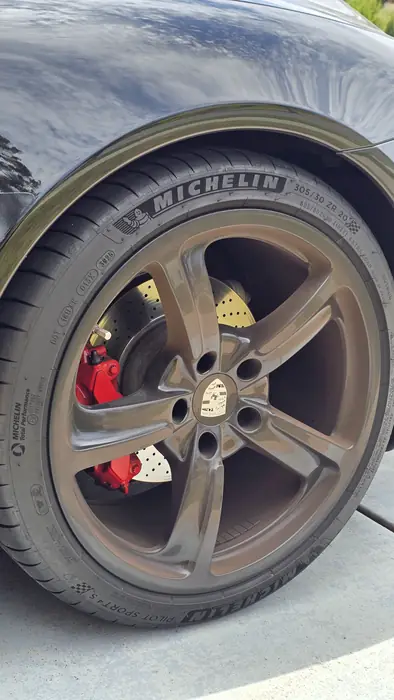 Porsche wheel cleaned inside and out, with the tire dressed